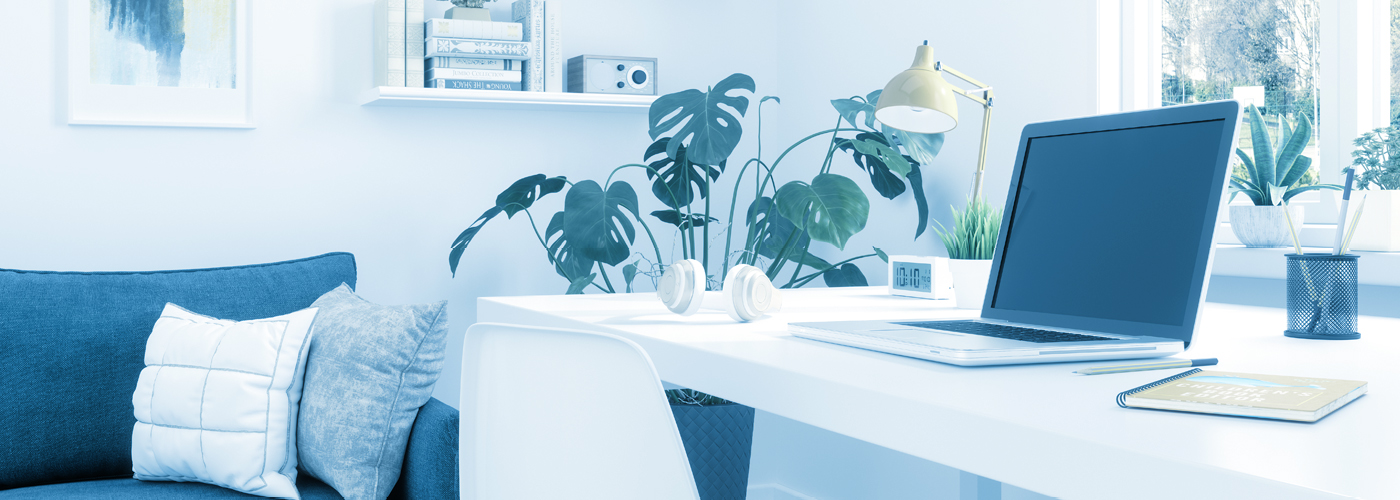 Laptop with headphones sitting on a table in an apartment Laptop with headphones sitting on a table in an apartment